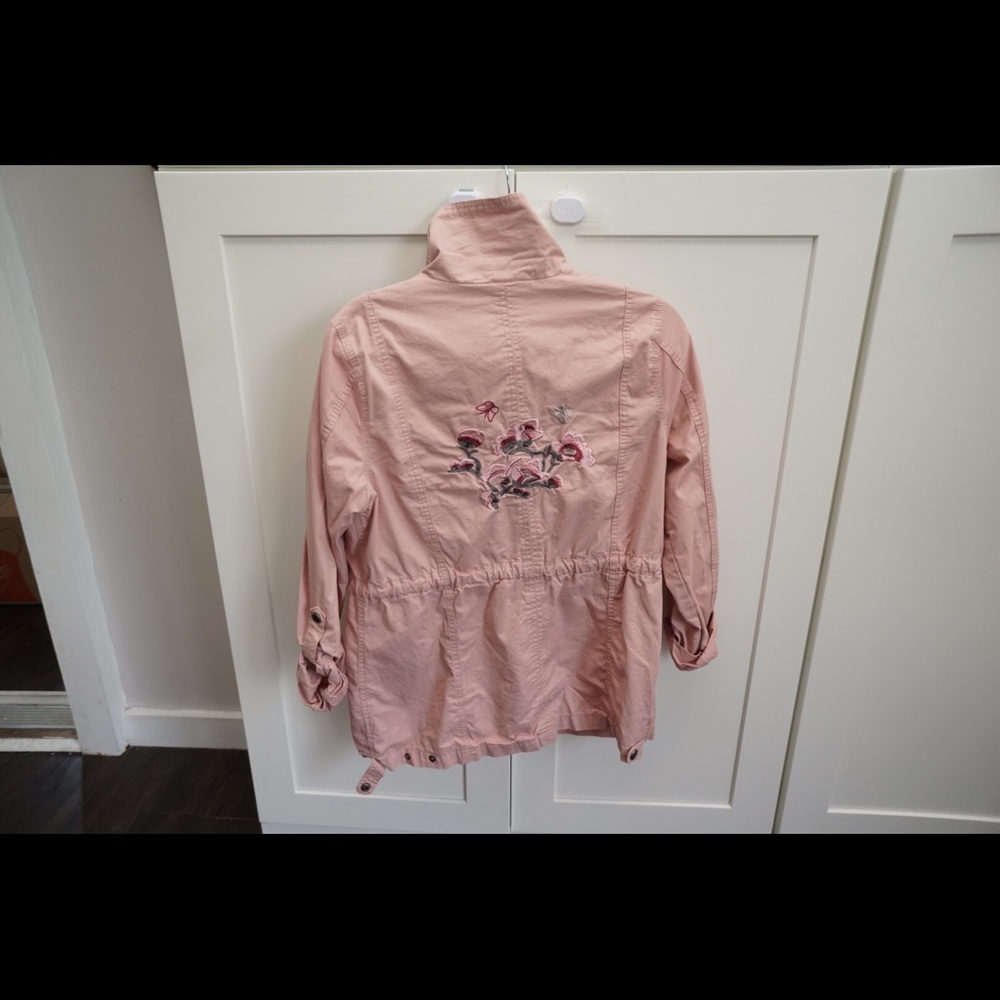 Pink army jacket with floral appliqués